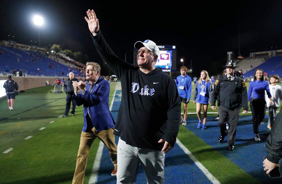 Duke head coach Mike Elko acknowledges the crowd while walking off the field after Duke’s 24-3 victory over N.C. State at Wallace Wade Stadium in Durham, N.C., Saturday, Oct. 14, 2023.