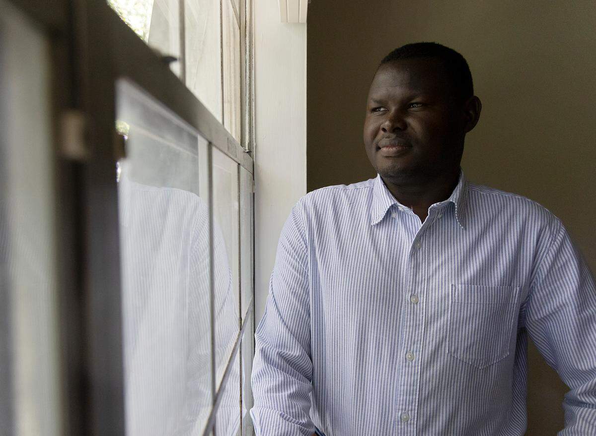 Adam Sadda, photographed on Tuesday, July 4, 2023, in Durham, N.C., was a teenager when he and his family fled genocide in Darfur, Sudan. He arrived in Durham in 2013 and recently graduated from UNC-Greensboro with a bachelor’s degree.