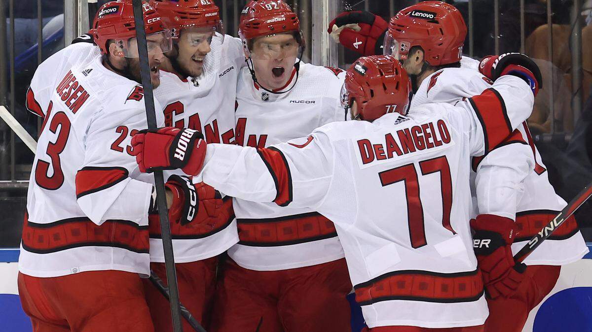 May 13, 2024; New York, New York, USA; Carolina Hurricanes center Evgeny Kuznetsov (92) celebrates his goal against the New York Rangers with teammates during the third period of game five of the second round of the 2024 Stanley Cup Playoffs at Madison Square Garden. Mandatory Credit: Brad Penner-USA TODAY Sports