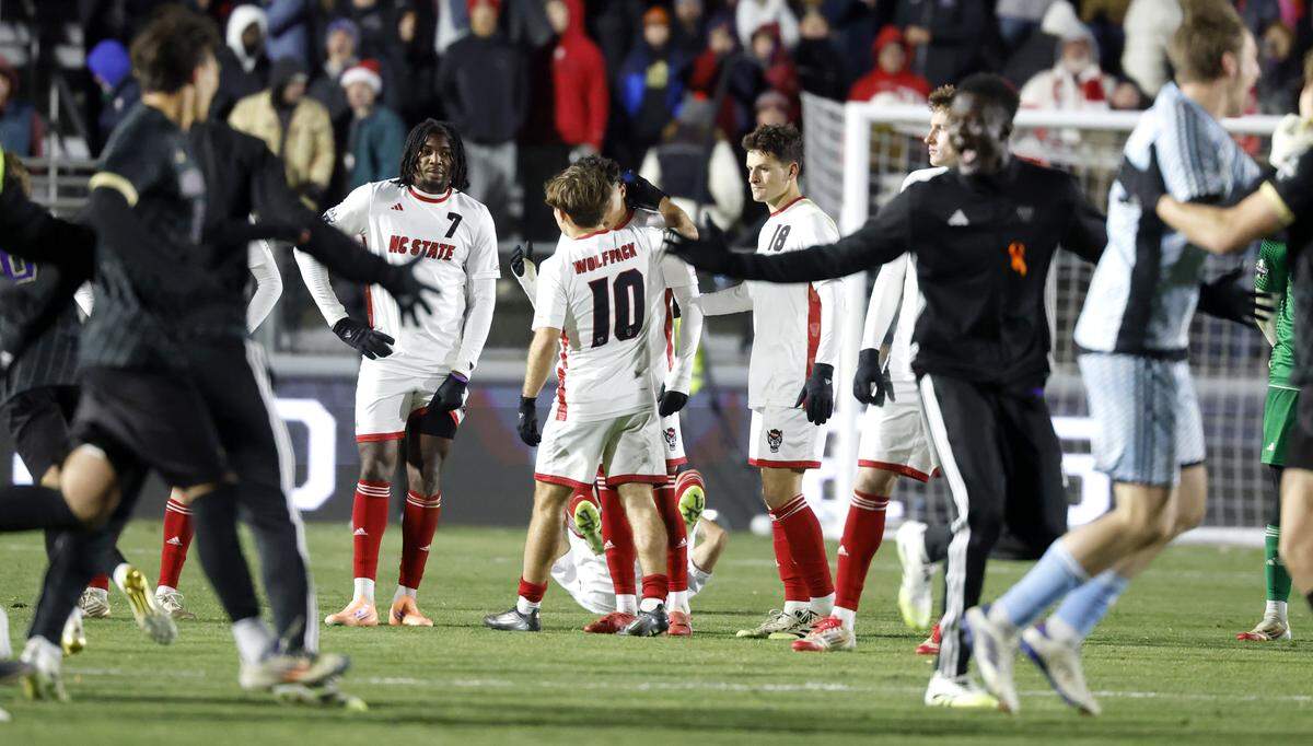 Washington celebrates after their 3-2 overtime victory over N.C. State in the 2025 Men’s Soccer National Championship at WakeMed Soccer Park in Cary, N.C., Monday, Dec. 15, 2025.