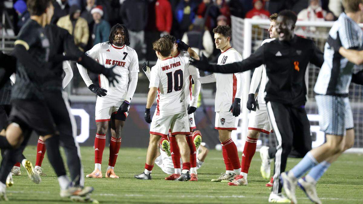 Washington celebrates after its 3-2 overtime victory over N.C. State in the 2025 Men’s Soccer National Championship at WakeMed Soccer Park in Cary, N.C., Monday, Dec. 15, 2025.