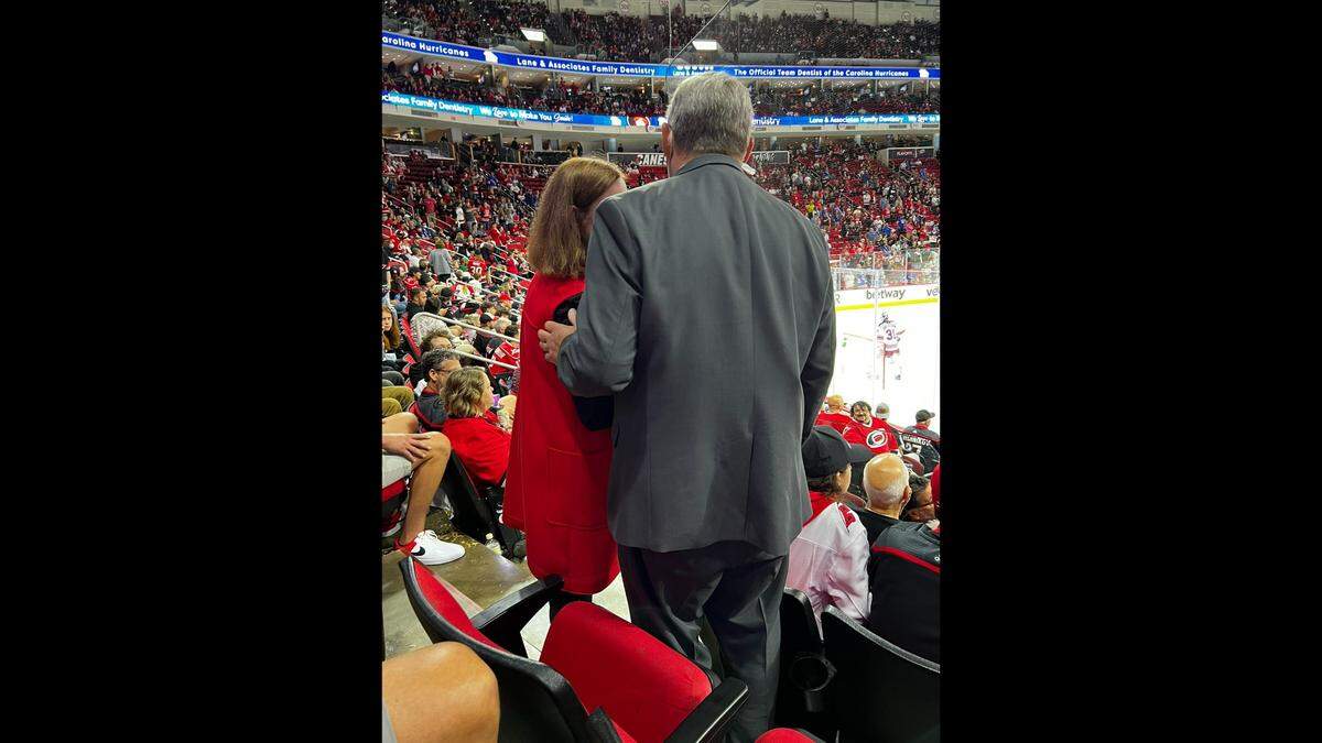 Raleigh Mayor Mary-Ann Baldwin speaks with an usher at PNC Arena after an exchange with a New York Rangers fan.