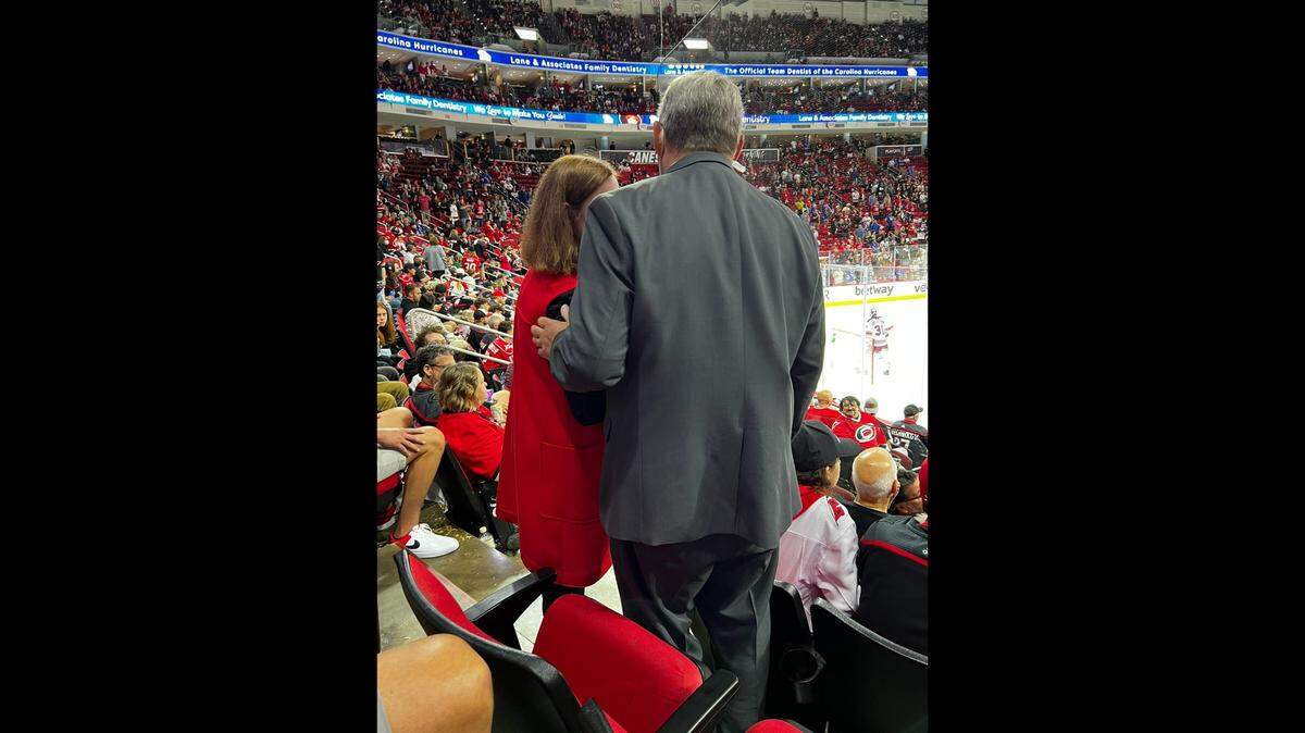 Raleigh Mayor Mary-Ann Baldwin speaks with an usher at PNC Arena after an exchange with a New York Rangers fan.