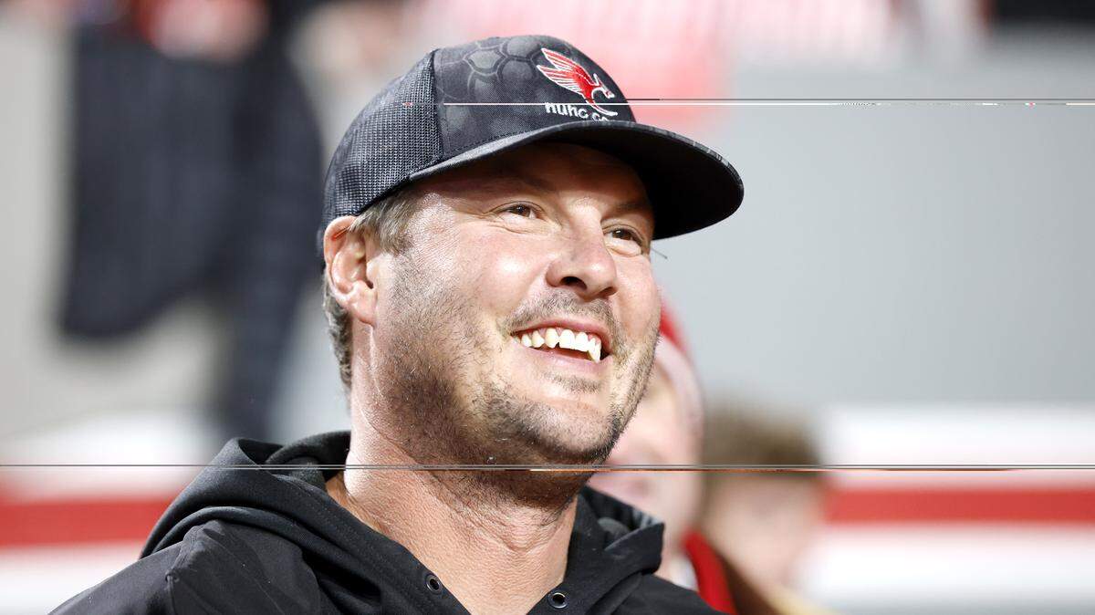 Former N.C. State quarterback Philip Rivers smiles as he stands on the sidelines before the Wolfpack’s game against UNC at Carter-Finley Stadium in Raleigh, N.C., Saturday, Nov. 29, 2025.