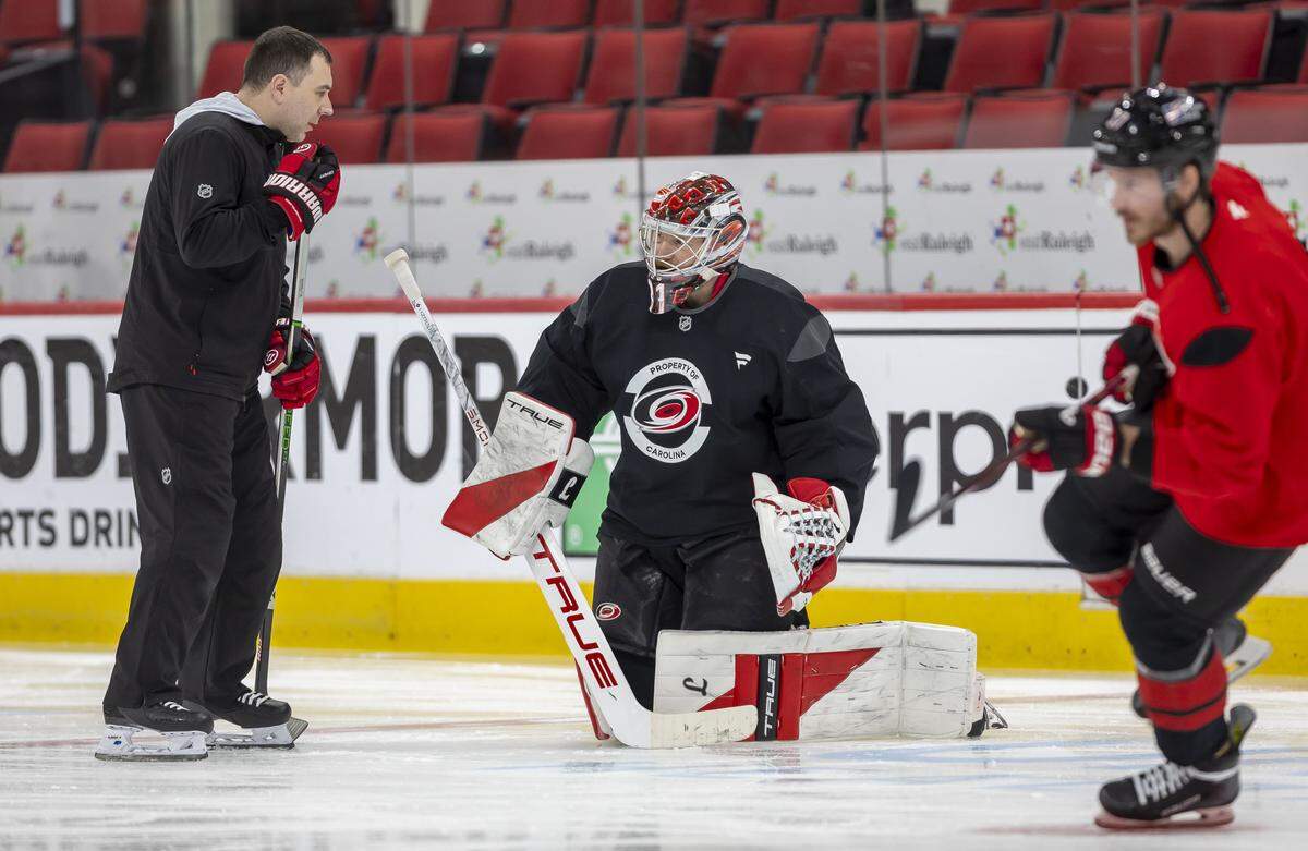 Carolina Hurricanes goal tending coach Paul Schonfelder talks with Frederik Andersen (31) during their practice, as they prepare for the Game 1 of the Stanley Cup Playoffs against Las Vegas, on Monday June 1, 2026 at Lenovo Center in Raleigh, N.C.