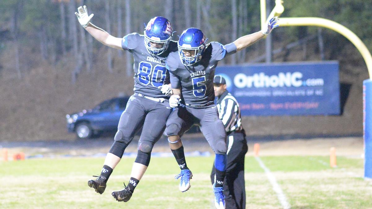 Keishmund Rodgers (5) of Wake Forest celebrates along his teammate Noah Krogh (80) after scoring a touchdown. The Pinecrest Patriots visited the Wake Forest Cougars in a high school football game on December 7, 2018. Wake Forest won 49-7.