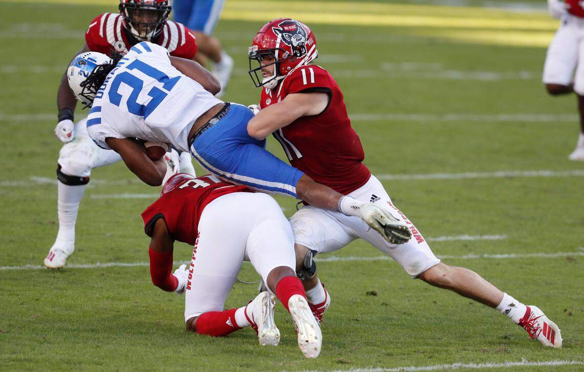 N.C. State’s Vi Jones (31) and Payton Wilson (11)Duke running back Mataeo Durant (21) during the first half of N.C. State’s game against Duke at Carter-Finley Stadium in Raleigh, N.C., Saturday, Oct. 17, 2020.