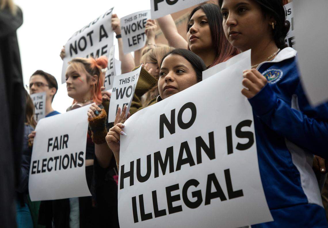 UNC-Chapel Hill freshman Estrella Rocha, center, holds a sign during a counter rally prior to an event featuring former Vice President Mike Pence at the Carolina Union on Wednesday, April 26, 2023, in Chapel Hill, N.C.