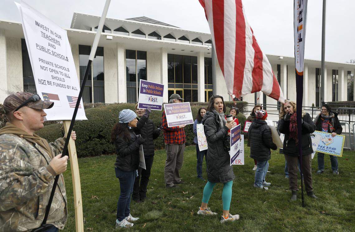 Public school advocates gather outside the N.C. Legislative Building in Raleigh to lobby for more public school funding Wednesday.