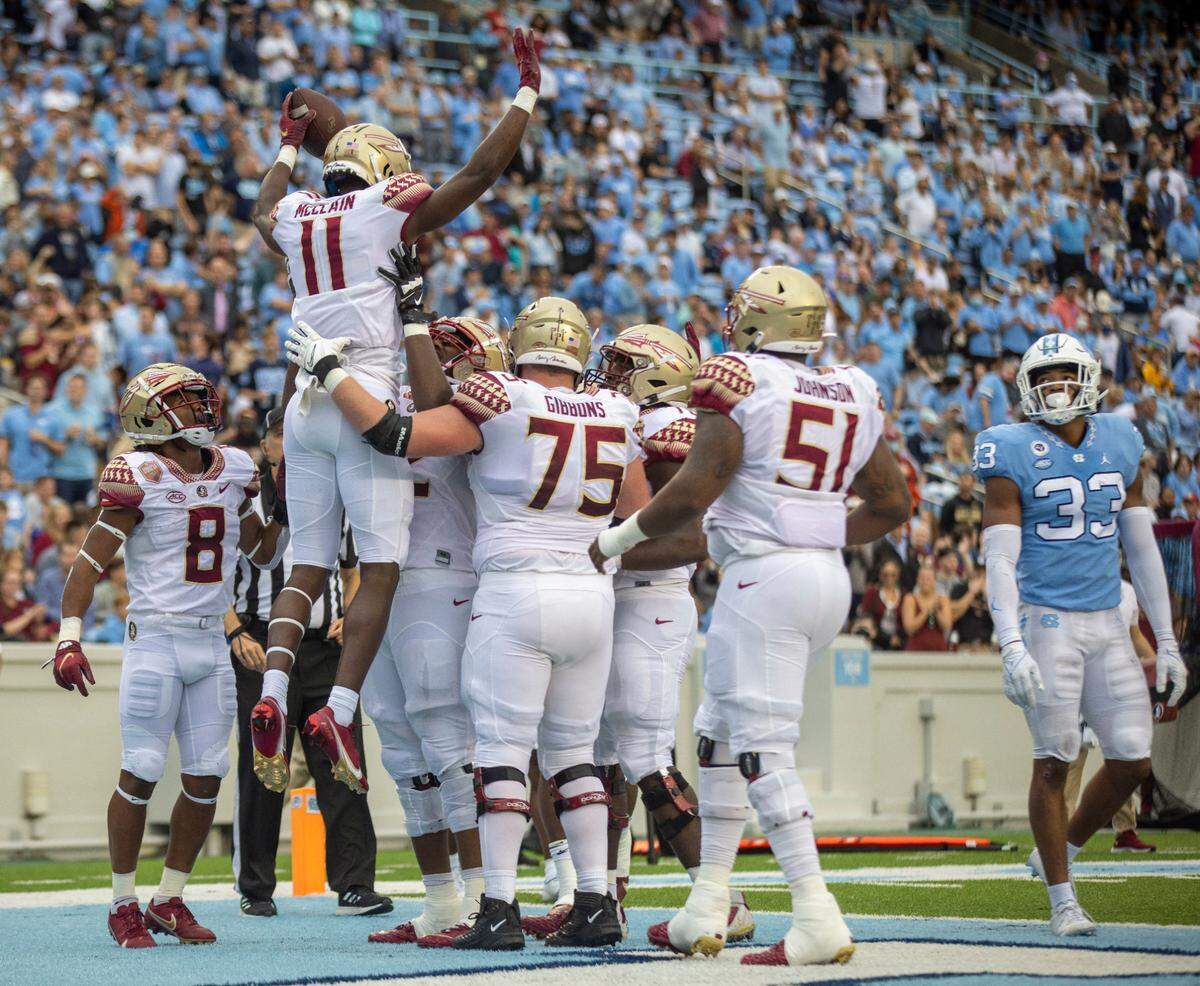 Florida State’s Malik McClain (11) celebrates after scoring on a five-yard pass from quarterback Jordan Travis in the second quarter against North Carolina on Saturday, October 9, 2021at Kenan Stadium in Chapel Hill, N.C.