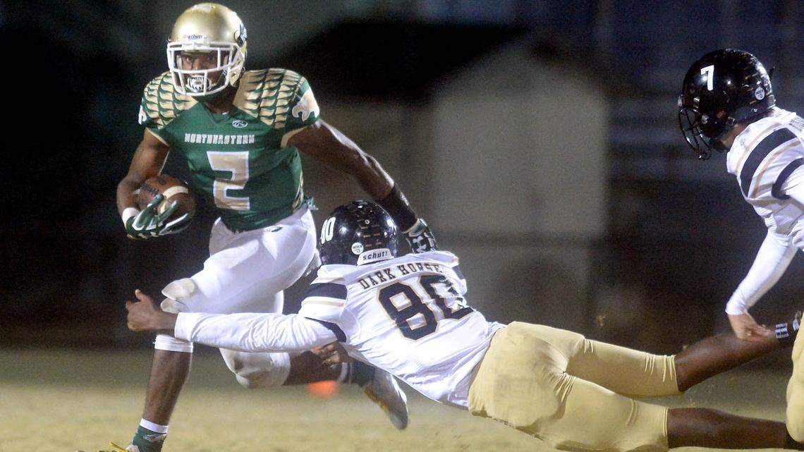 Northeastern's J.R. Walker, left, tweeted his top-five colleges, and UNC, Duke and NC State are on the list.