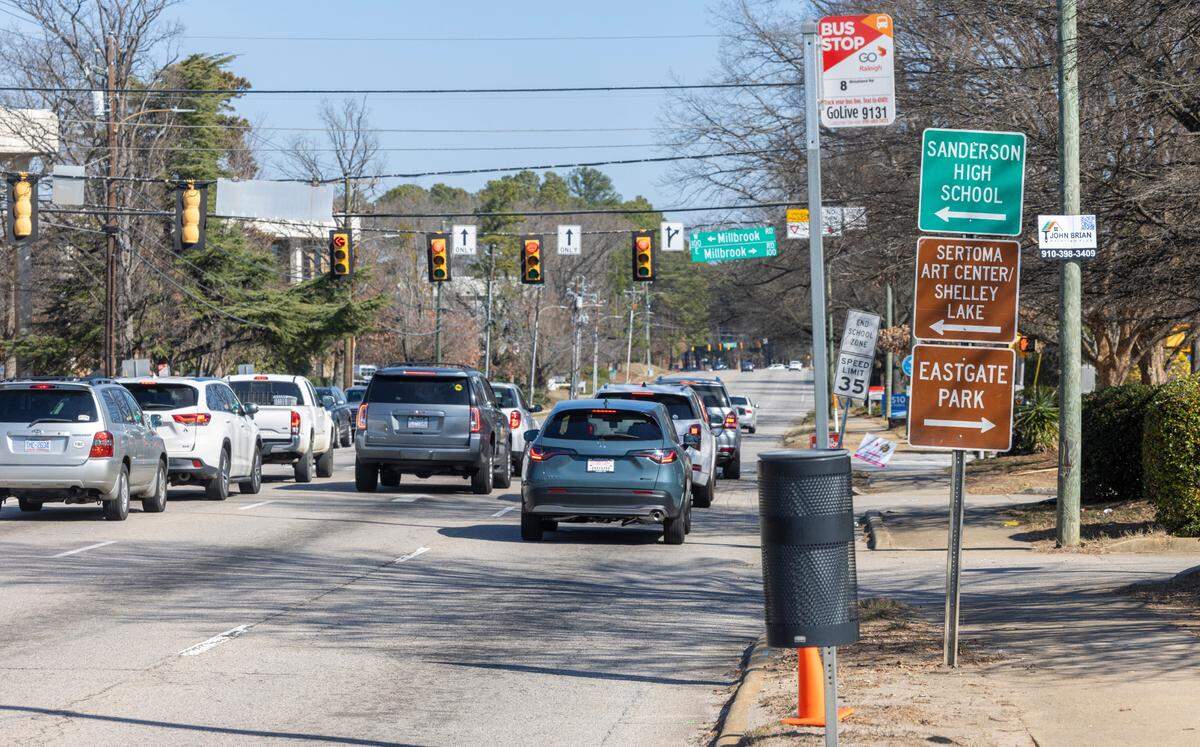 Traffic on Six Forks Road at the intersection with Millbrook Road on Wednesday, February 21, 2024 in Raleigh, N.C. The Raleigh City Council has approved improvements to this segment of Six Forks Road between Carroll Middle School and Millbrook Road that will widen the street to three travel lane and add a median The project includes construction of bike and pedestrian lanes on each side of the road.