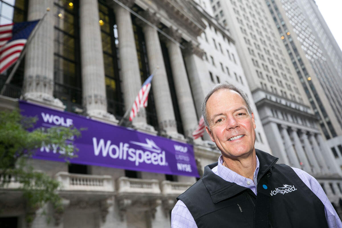Wolfspeed CEO Gregg Lowe stands in front of the New York Stock Exchange on Oct. 4, 2021.