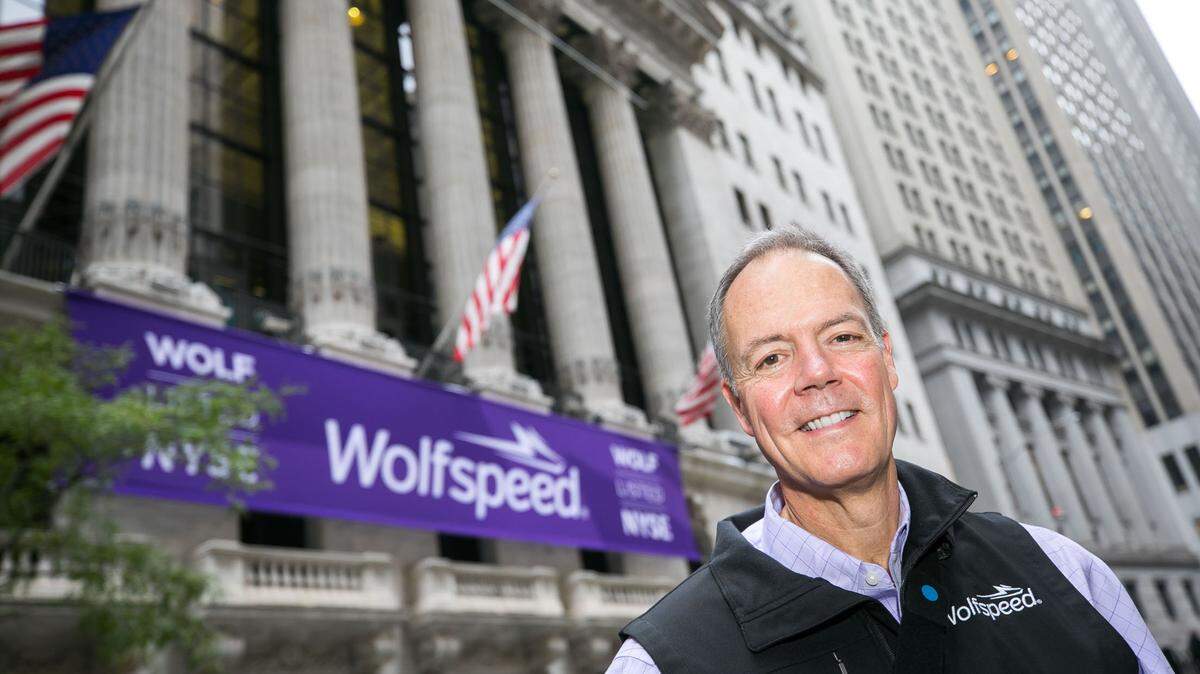 Wolfspeed CEO Gregg Lowe stands in front of the New York Stock Exchange on Oct. 4, 2021.