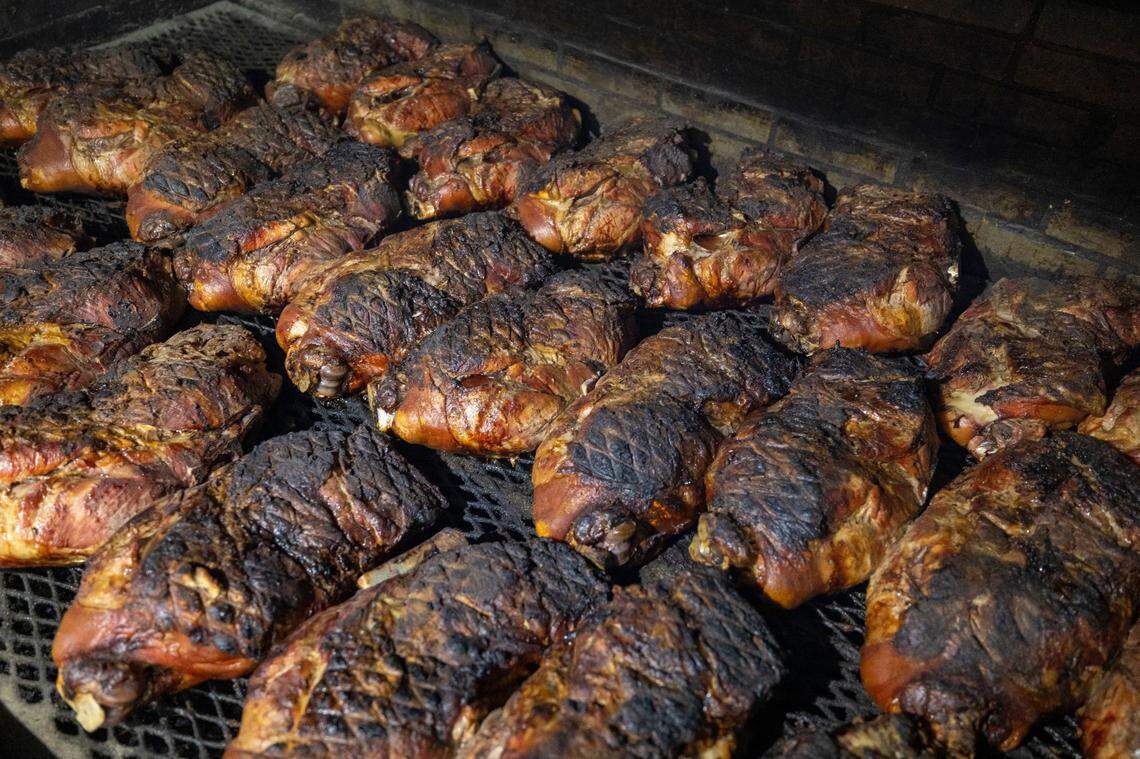 Finished pork shoulders are ready to remove from the pit at Lexington Barbecue on Tuesday, October 10, 2023 in Lexington, N.C.