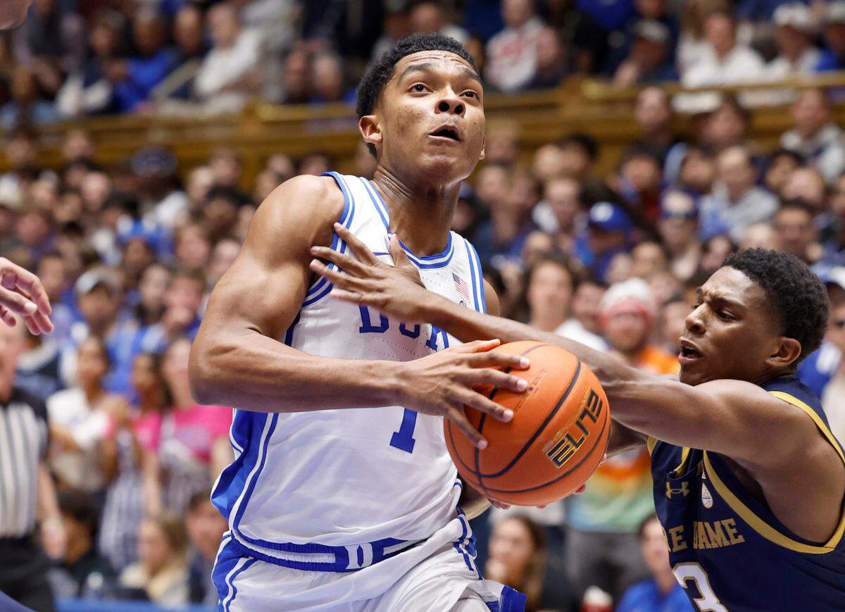 Duke’s Caleb Foster (1) drives to the basket past Notre Dame’s Markus Burton (3) during the first half of Duke’s game against Notre Dame at Cameron Indoor Stadium in Durham, N.C., Wednesday, Feb. 7, 2024.