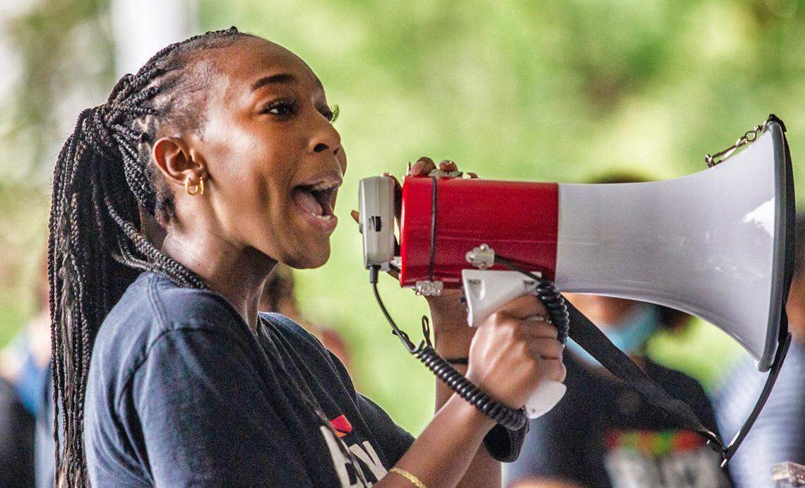 Taliajah Vann, president of the campus Black Student Movement, speaks as about 200 demonstrators rally at UNC-Chapel Hill Friday, June 25, 2021 demanding trustees approve tenure for Nikole Hannah-Jones, who created The New York Times’ ”1619 Project,” which explores the legacy and history of Black Americans and slavery.