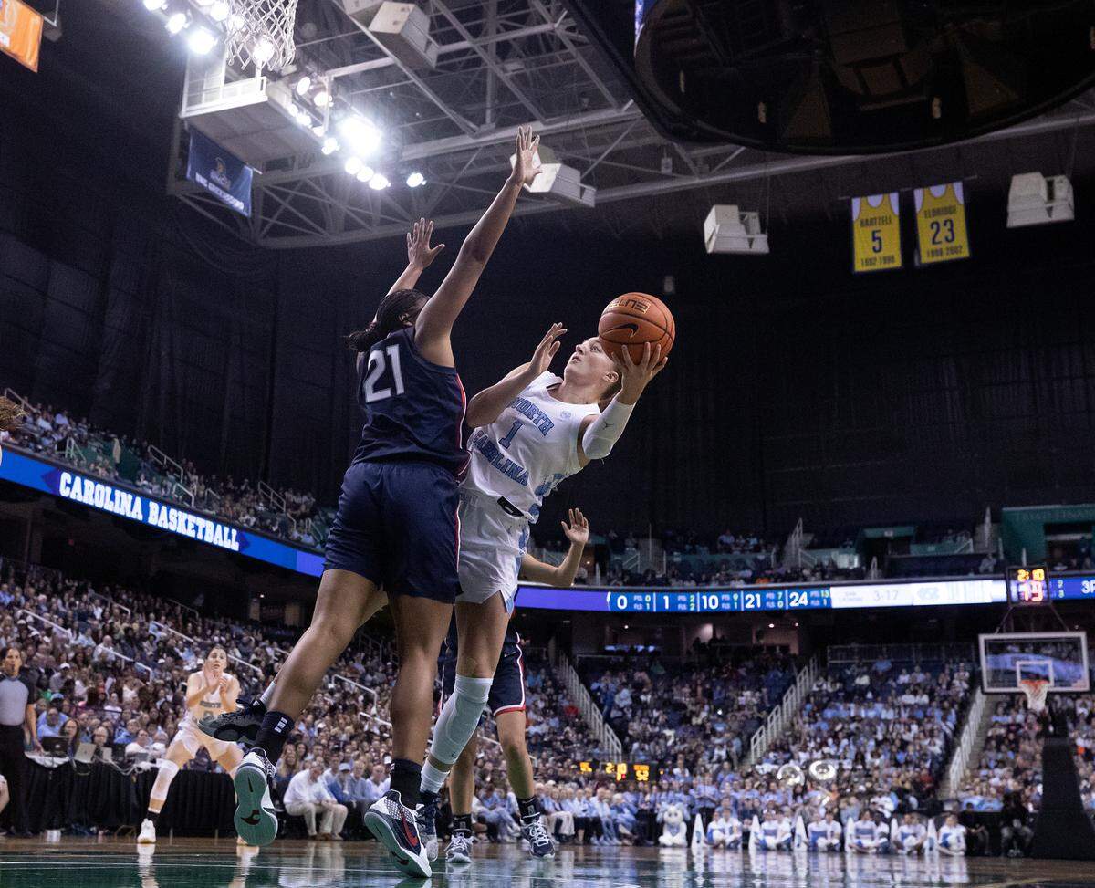 North Carolina’s Alyssa Ustby shoots around UConn’s Sarah Strong during the second half of the Tar Heels’ 69-58 loss on Friday, Nov. 15, 2024, at First Horizon Coliseum in Greensboro, N.C.