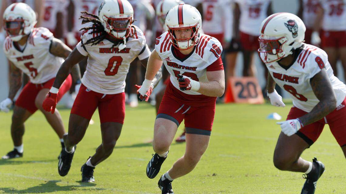 N.C. State linebacker Caden Fordham (10) and the defense run drills during the Wolfpack’s first practice in Raleigh, N.C., Wednesday, July 31, 2024.
