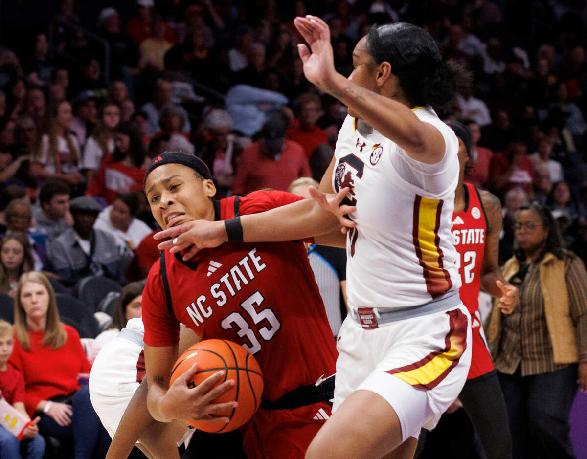 N.C. State’s Zoe Brooks drives against South Carolina’s Te-Hina Paopao during the second half of the Wolfpack’s 71-57 loss on Sunday, Nov. 10, 2024, at Spectrum Center in Charlotte, N.C.