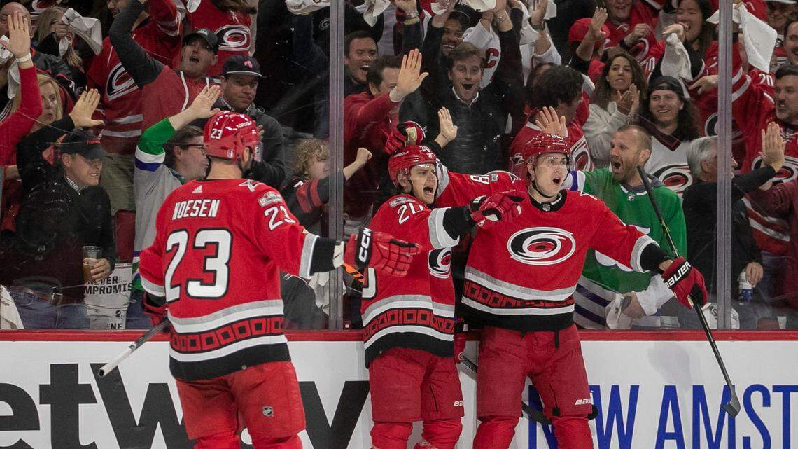 Carolina Hurricanes’ Sebastian Aho (20) celebrates with teammates Stefan Noesen (23) and Martin Necas (88) after scoring on New York Islanders goalie Ilya Sorokin (30) to take a 1-0 lead on Monday, April 17, 2023 at PNC Arena in Raleigh, N.C.