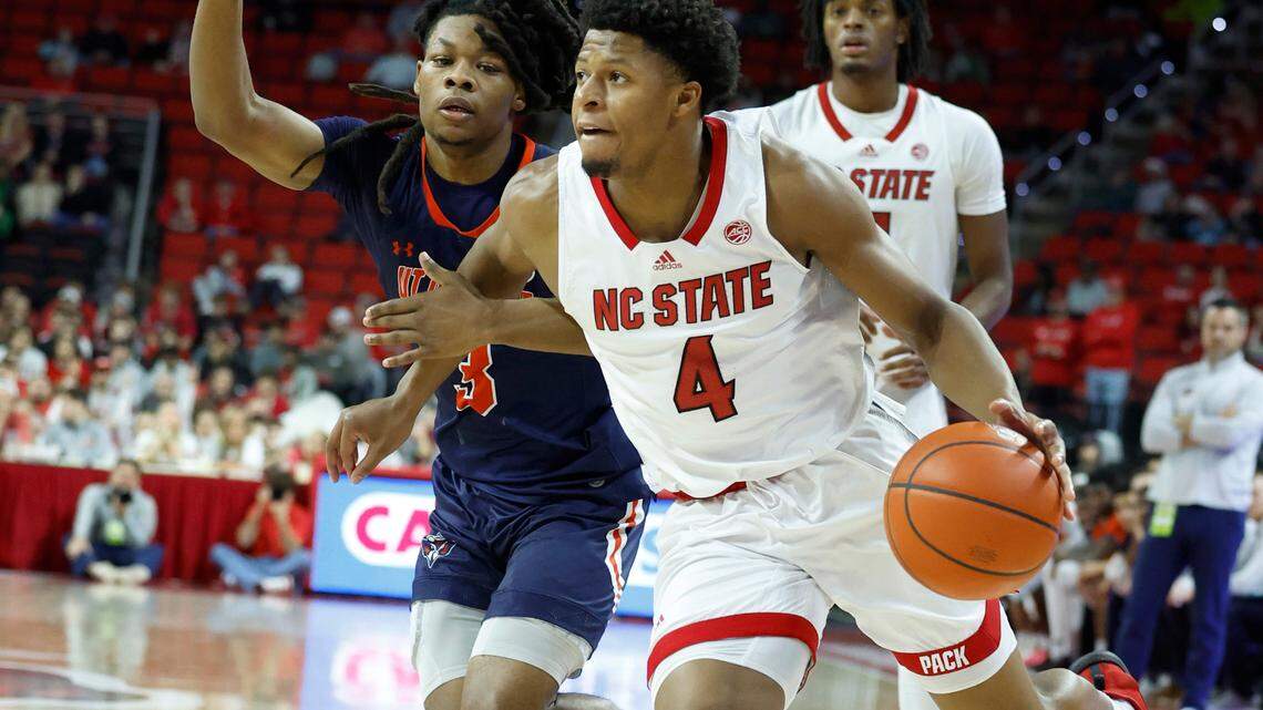 N.C. State’s LJ Thomas (4) drives around UT Martin’s Jordan Sears (3) during the second half of N.C. State’s 81-67 victory over UT Martin at PNC Arena in Raleigh, N.C., Tuesday, Dec. 12, 2023.