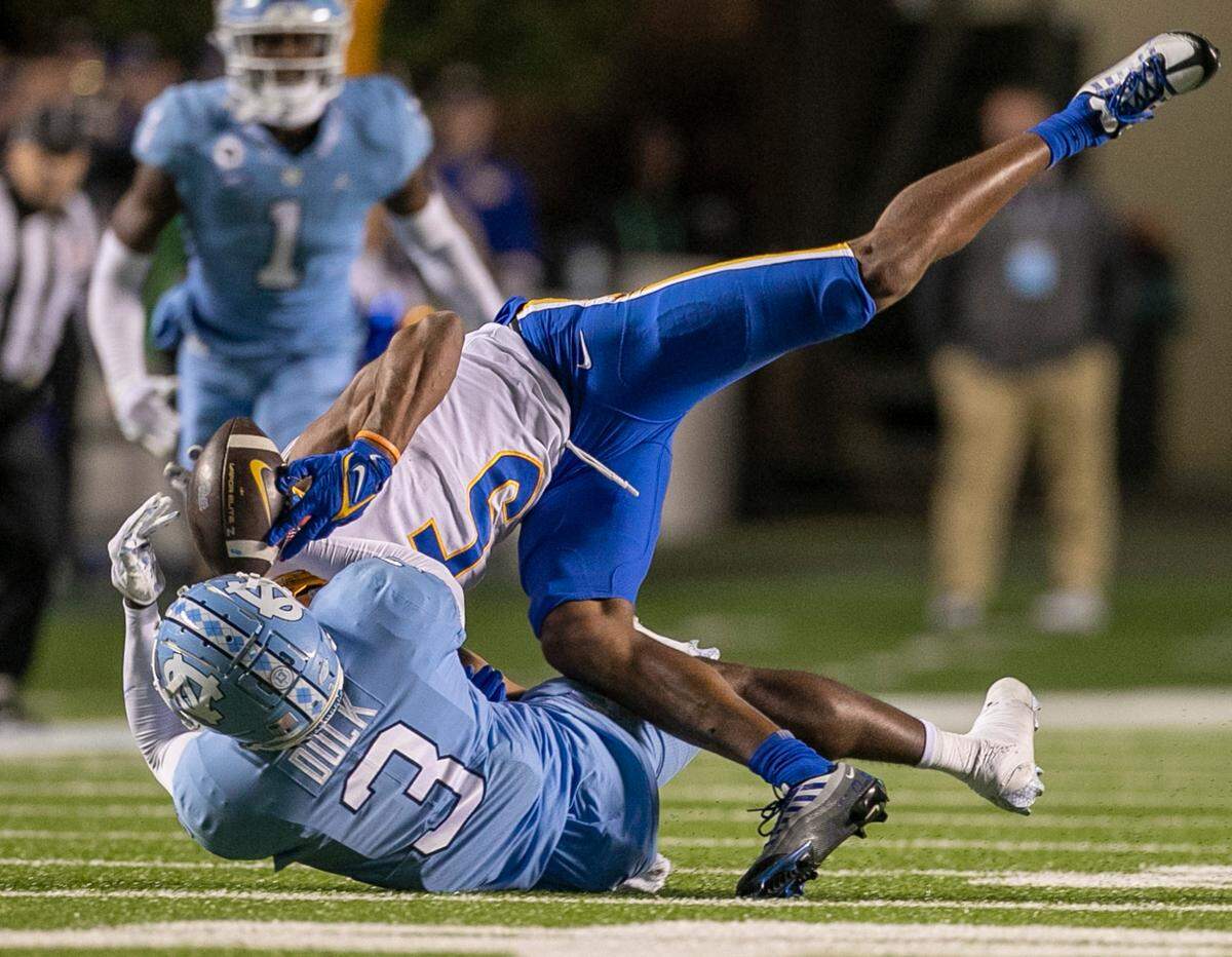 North Carolina’s Storm Duck breaks up a pass intended for Pitt’s Jared Wayne (5) on fourth down in the fourth quarter, turning the ball over to the Tar Heels on Saturday, October 29, 2022 at Kenan Stadium in Chapel Hill, N.C.