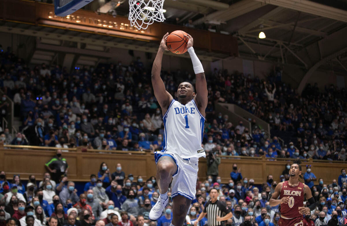 Duke’s Trevor Keels (1) breaks to the basket on a fast break for a dunk during the first half on Saturday, December 18, 2021 at Cameron Indoor Stadium in Durham, N.C. Keels lead all scores with 19 points and the Blue Devils to an 87-56 victory over Elon.