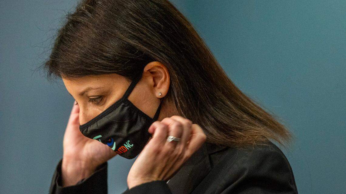 Secretary of the NC Department Health and Human Services Dr. Mandy Cohen removes her mask before speaking during a briefing on North Carolinas coronavirus pandemic response Tuesday, Dec. 22, 2020 at the NC Emergency Operations Center in Raleigh.