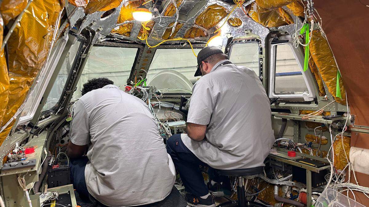 Brandon Ortiz, left, and Christian Alvarez test the wiring connections on an avionics system being installed in a Citation XL jet at flyExclusive in the N.C. Global TransPark in Kinston. The private jet company has about 800 employees, most at its headquarters in Kinston.