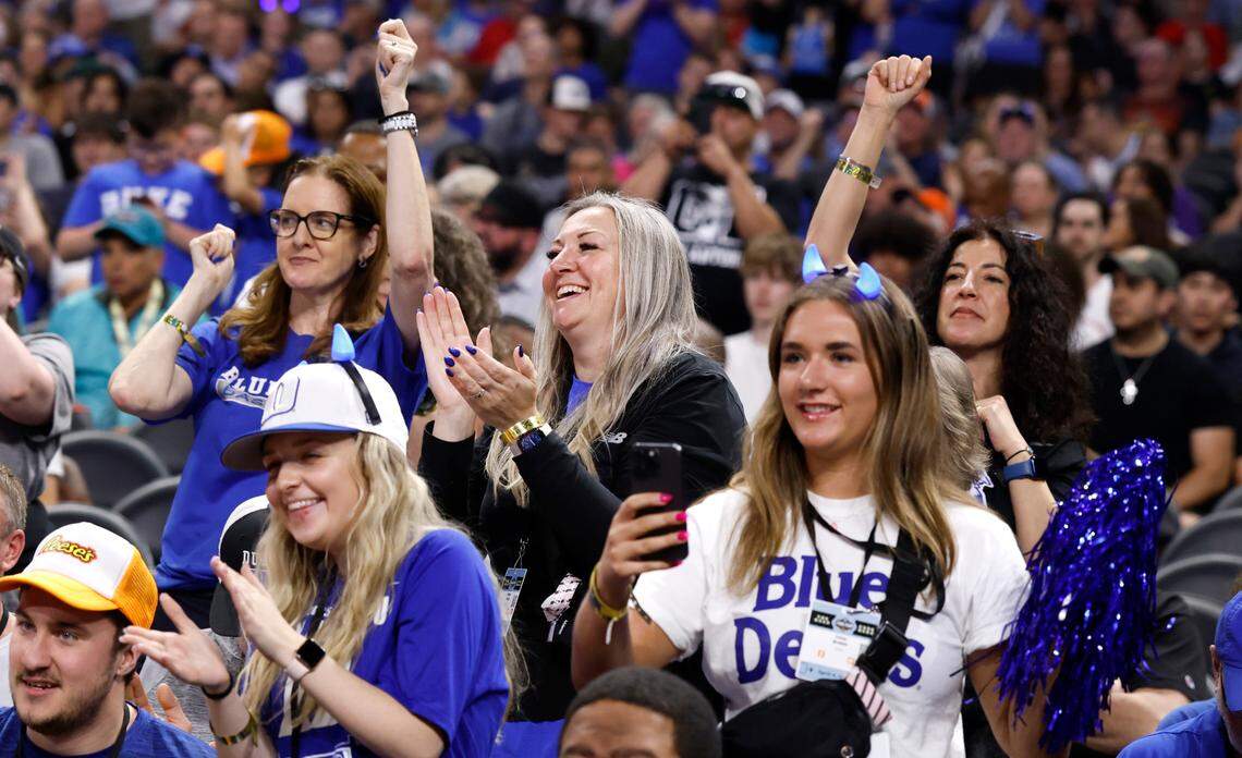 Kelly Flagg, center, is among the fans and family cheering on the Blue Devils during Duke’s practice at the Alamodome in San Antonio, Texas, Friday, April 4, 2025.