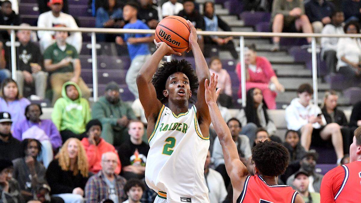 Richmond’s Paul McNeill (2) takes the jump shot over Jordan’s Drew Johnson (5) during the first half at the John Wall Invitational. The Richmond Raiders and the Jordan Falcons met in the John Wall Holiday Invitational in Raleigh, N.C. on December 28, 2023.
