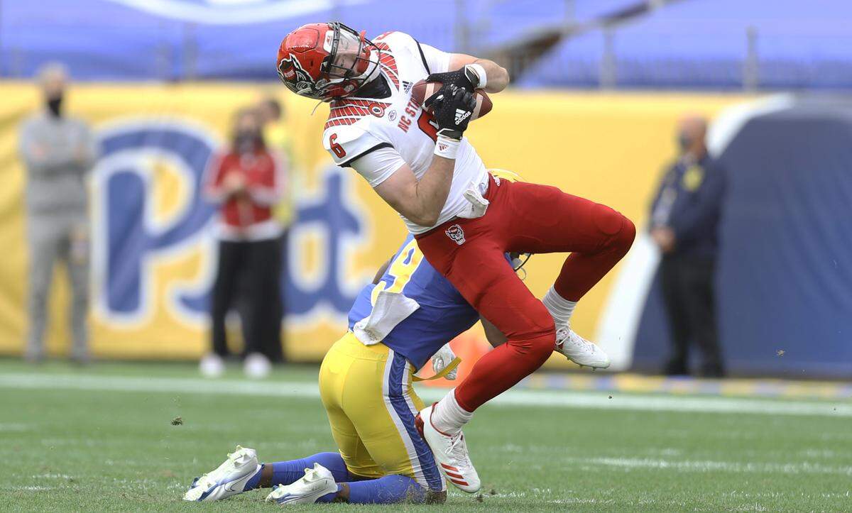 N.C. State’s Cary Angeline (6) makes a catch while defend by the Pittsburgh Panthers defensive back Brandon Hill (9) during the Wolfpack’s victory over the Panthers at Heinz Field in Pittsburgh, PA, Saturday, Oct. 3, 2020.