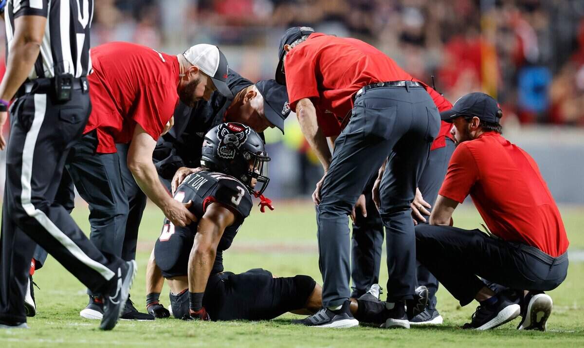 N.C. State running back Jordan Houston (3) is helped up after he was injured during the second half of N.C. States 27-14 victory over Texas Tech at Carter-Finley Stadium in Raleigh, N.C., Saturday, Sept. 17, 2022.