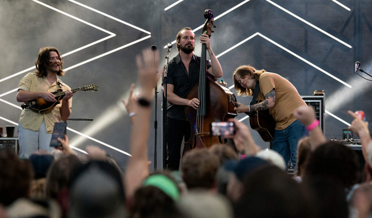 Billy Strings and his band play the first of three nights at Cary, N.C.’s Booth Amphitheater, Thursday, June 23, 2022. From left: Jarrod Walker, Royal Masat and Strings.