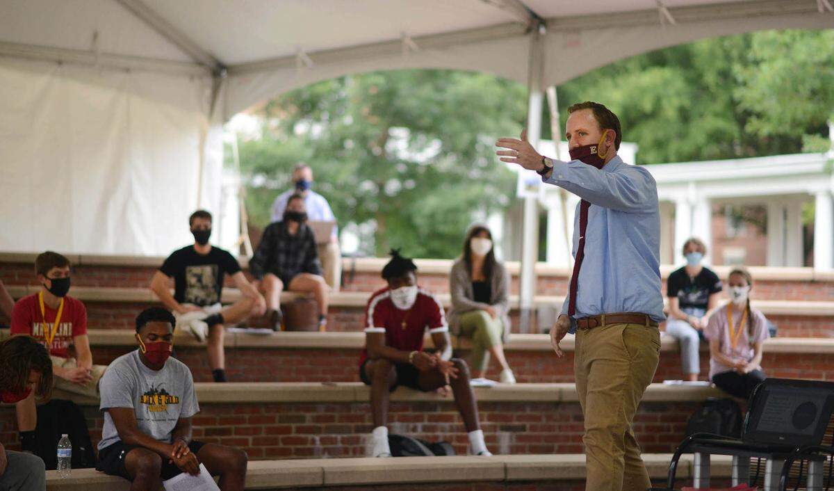Elon University Assistant Professor Sandy Marshall teaches during his Human Geography course under a tent in front of Lindner Hall in Elon, N.C., in August 2020.