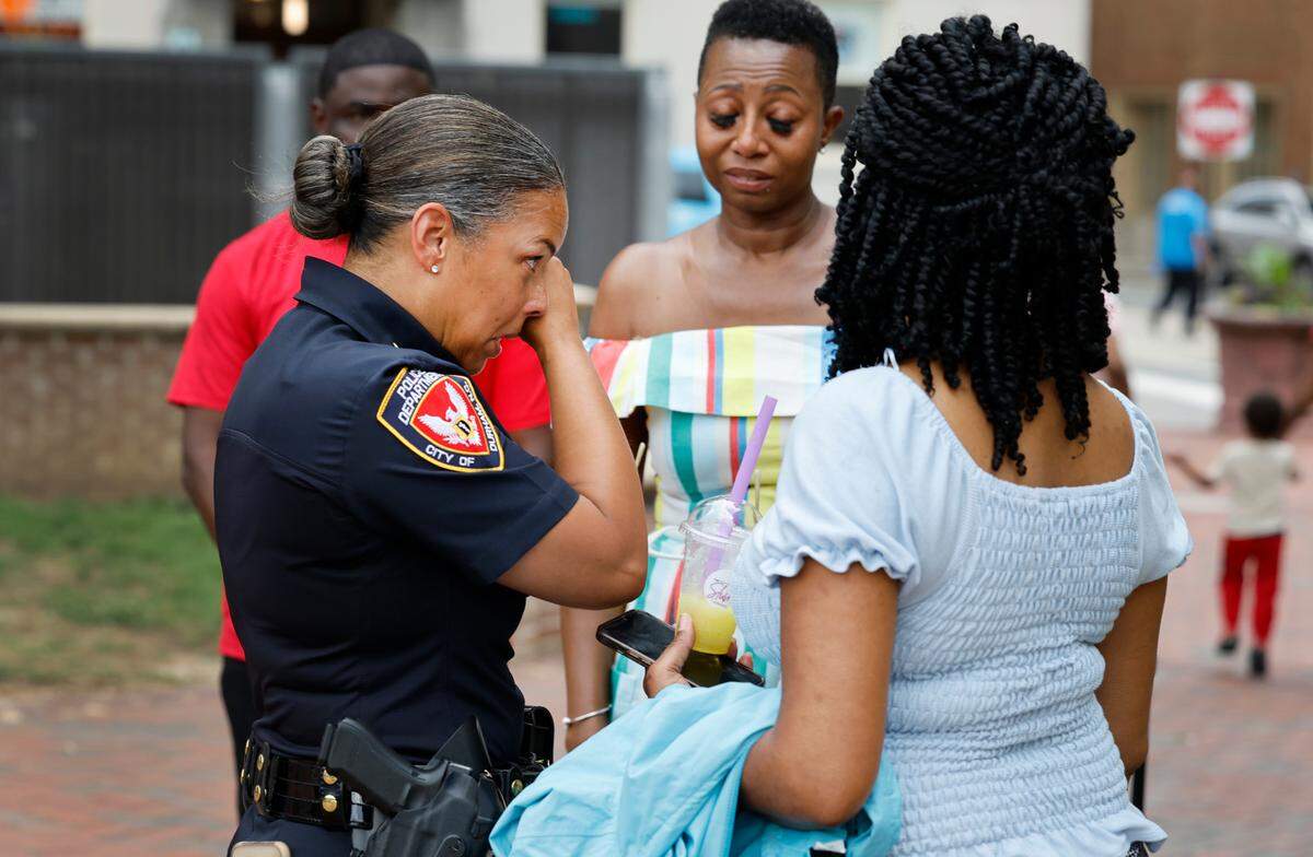 Durham Police Chief Patrice Andrews wipes her eyes while talking with Shea Ramirez, center, and Felecia Robinson, right, after a prayer vigil at CCB Plaza in Durham, N.C., Thursday, July 6, 2023. Ramirez, a local activist who organized Thursday’s event, said she felt called to host a community prayer event after she heard about 5-year-old Khloe Fennell’s death on Wednesday.