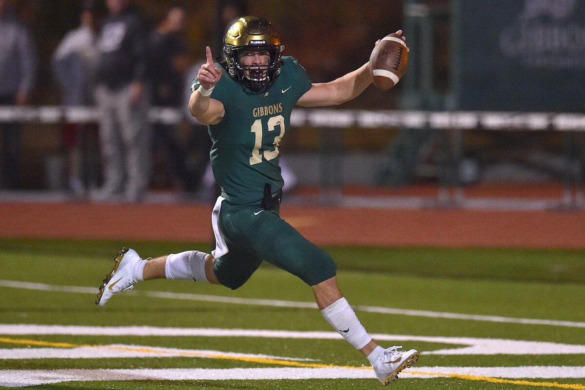 Cardinal Gibbons’ Ethan grace (13) celebrates after he ran the ball into the end zone off the interception in the second half. The Heritage Huskies and the Cardinal Gibbons Crusaders met in a NCHSAA 4A second round playoff game in Raleigh, N.C. on November 12, 2021