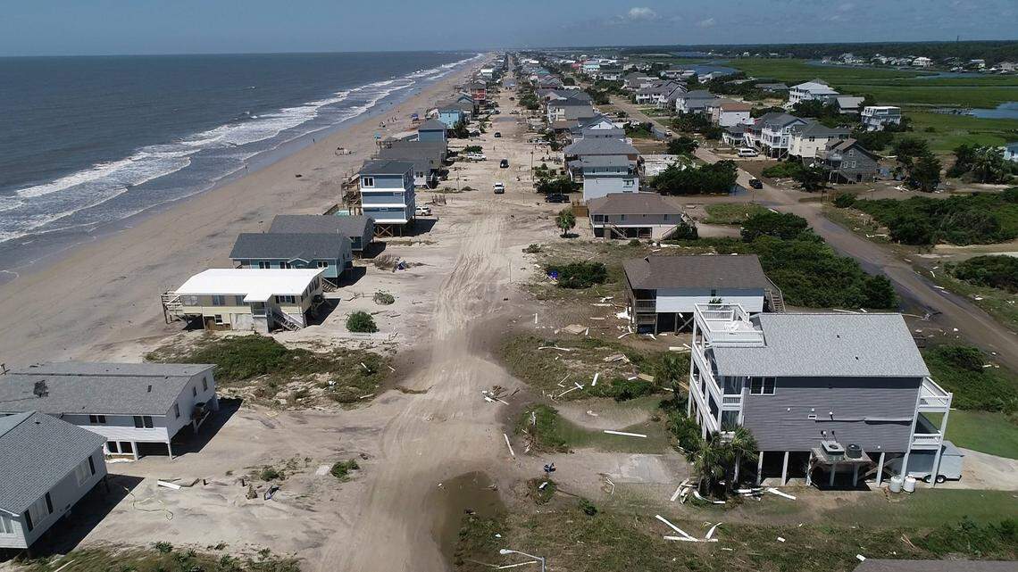 Oak Island sustained wind and flood damage caused by Hurricane Isaias leaving the streets strewn with debris and covered with more than a foot of sand in areas close to the beach Tuesday, August 4, 2020.