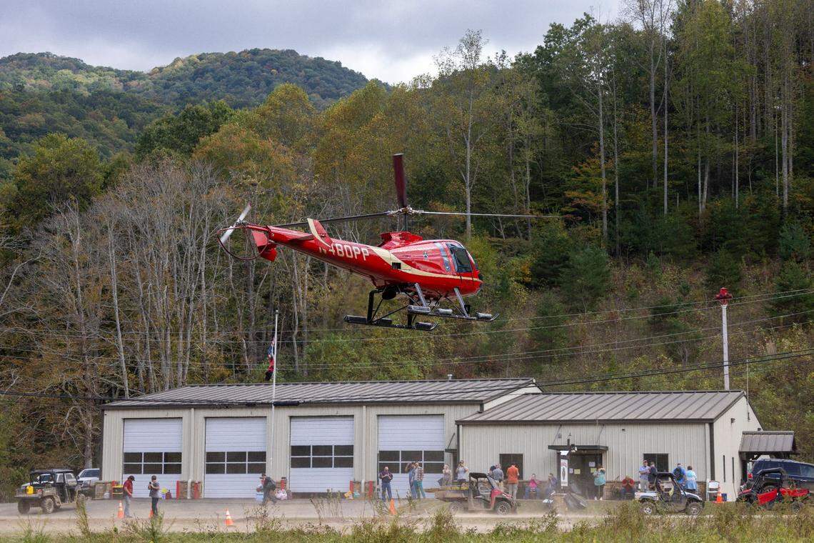 Helicopter pilot Brett James, with Willow Creek Aviation of Louisburg, N.C. departs the Pensacola Fire Department after dropping off medical supplies, food and water, shuttling them from Hickory, N.C. to the Yancey County, N.C. village of Pensacola on Thursday, October 3, 2024. The area has been heavily damaged from Hurricane Helene, with the roads in inaccessible due to flooding.