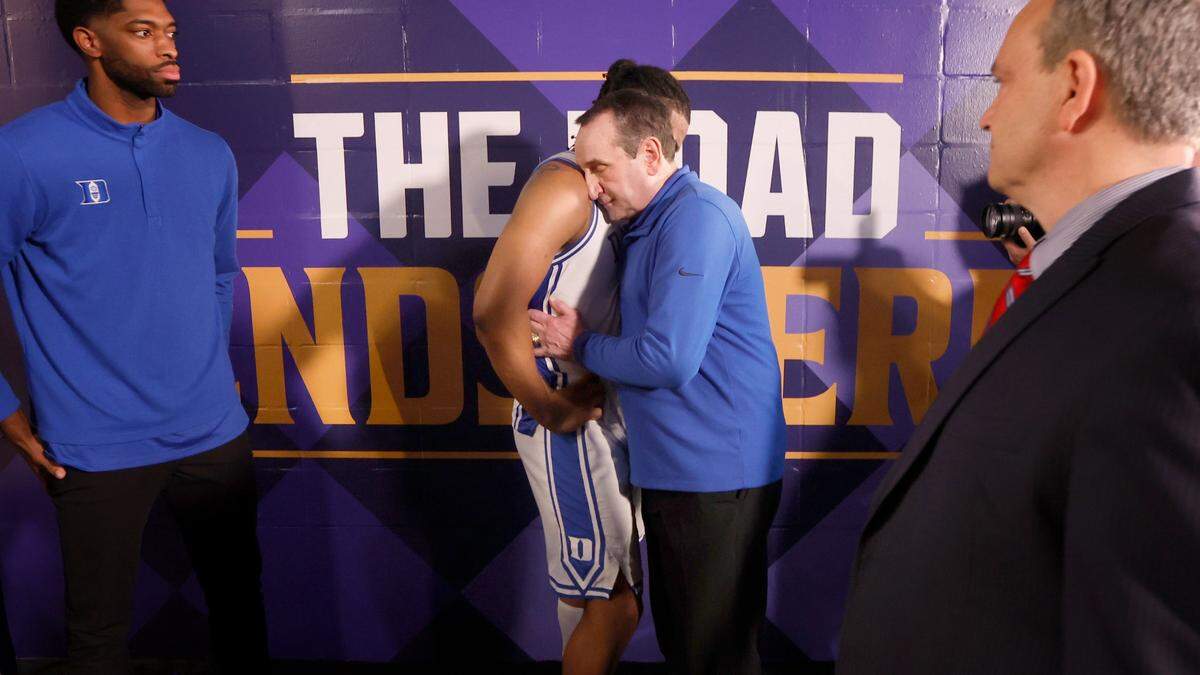 Duke head coach Mike Krzyzewski hugs Trevor Keels (1) after UNCís 81-77 victory over Duke in the Final Four at Caesars Superdome in New Orleans, La., Saturday, April 2, 2022.