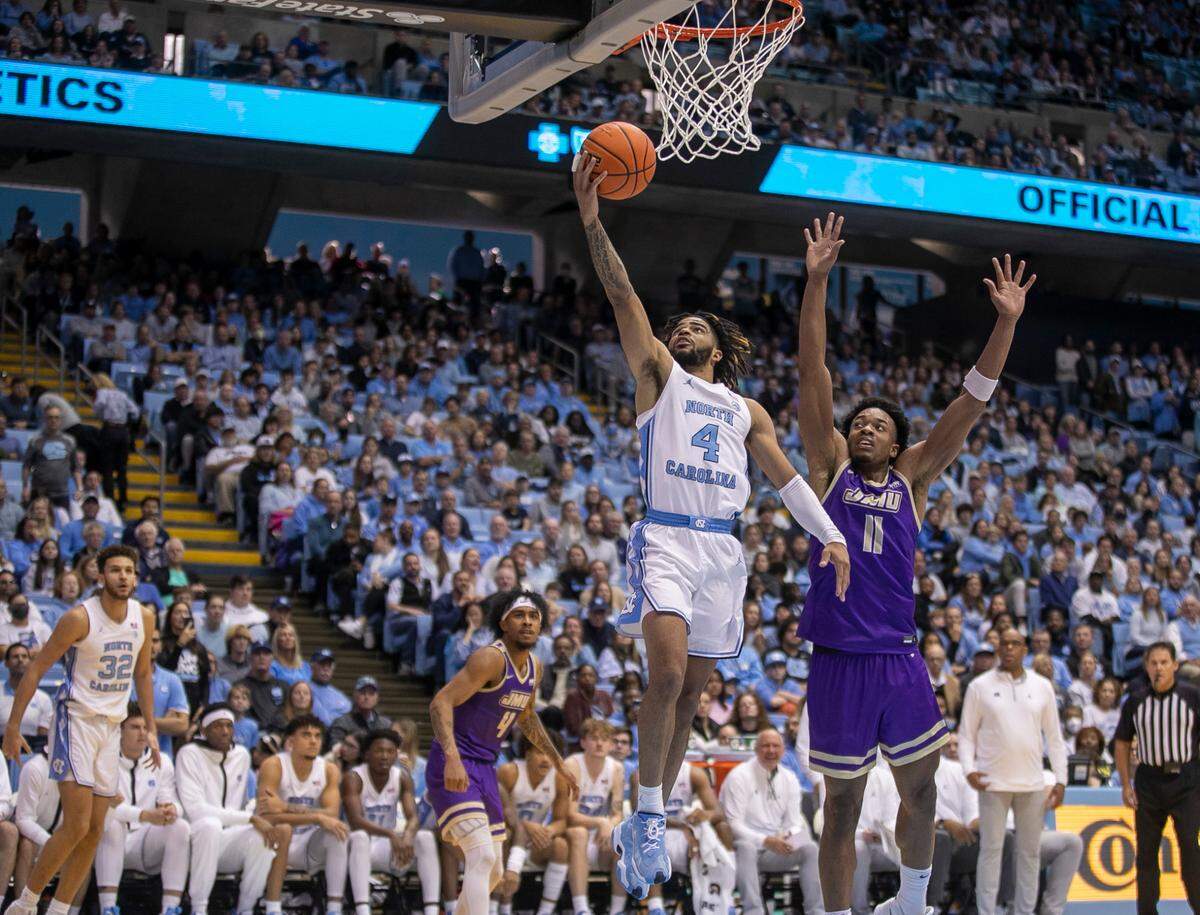 North Carolina’s R.J. Davis (4) drives to the basket against James Madison’s Justin Amadi (11) in the second half on Sunday, November 20, 2022 at the Smith Center in Chapel Hill, N.C. Davis lead all scores with 21 points in the Tar Heels’ 80-64 victory.