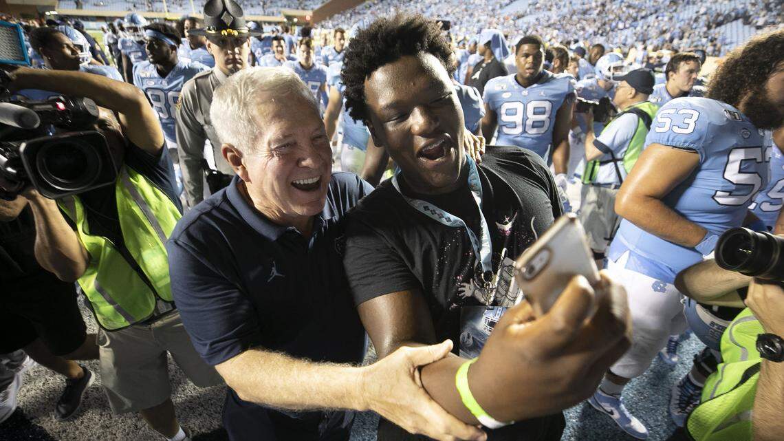Recruit Travis Shaw takes a selfie with North Carolina coach Mack Brown following the Tar Heels’ 28-25 victory over Miami on Saturday, September 7, 2019 at Kenan Stadium in Chapel Hill, N.C.