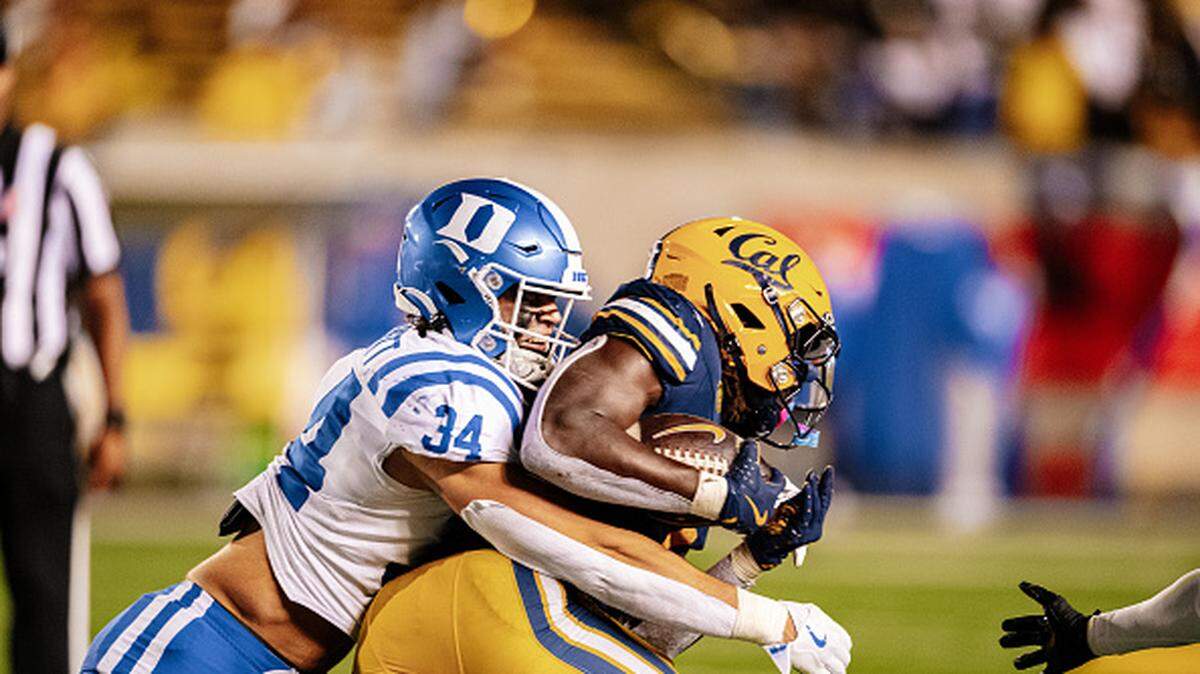 BERKELEY, CA - OCTOBER 04: Duke Blue Devils linebacker Luke Mergott (34) tackles California Golden Bears running back Kendrick Raphael (1)  during a college football game between the Duke Blue Devils against the California Golden Bears on October 4, 2025 at California Memorial Stadium in Berkeley, CA. (Photo by Trinity Machan/Icon Sportswire via Getty Images)