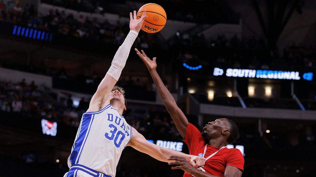 Duke’s Kyle Filipowski and N.C. State’s Mohamed Diarra battle for a rebound during the first half of the Wolfpack’s NCAA Tournament Elite Eight matchup on Sunday, March 31, 2024, at American Airlines Center in Dallas, Texas.