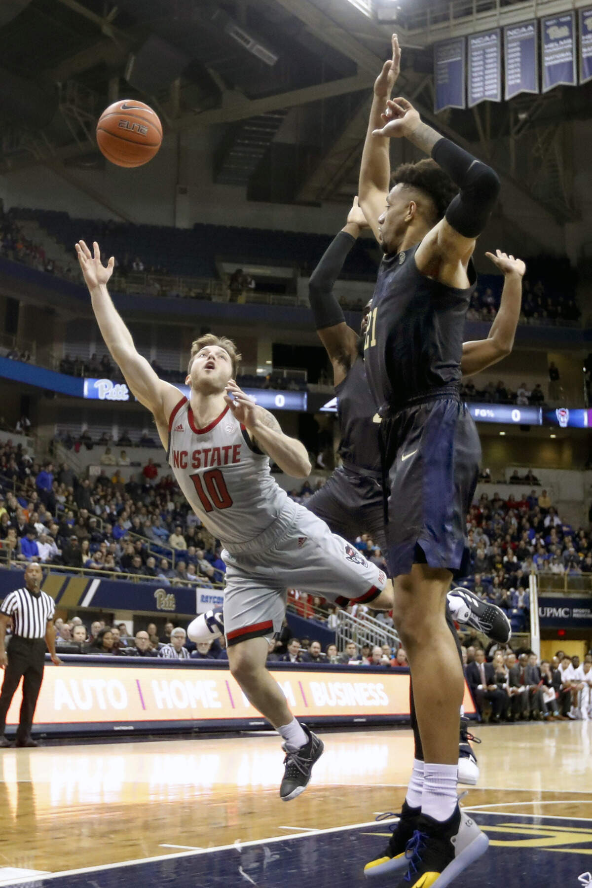 North Carolina State’s Braxton Beverly (10) shoots as Pittsburgh’s Terrell Brown, right defends during the first half of an NCAA college basketball game, Saturday, Feb. 9, 2019, in Pittsburgh. North Carolina State won 79-76. (AP Photo/Keith Srakocic)