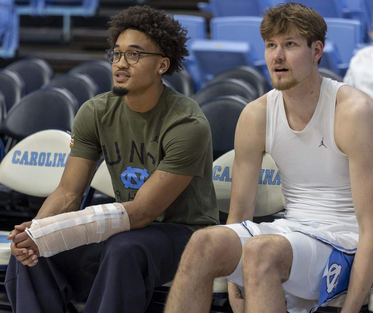 North Carolina guard Seth Trimble (7), out after breaking a bone in his left arm, talks with center Henri Veesaar (13) prior to the Tar Heels’ game against Radford on Tuesday, November 11, 2025 at the Smith Center in Chapel Hill, N.C.