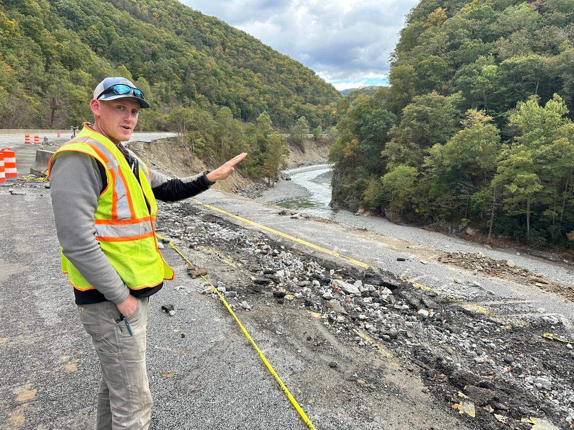 Daniel Ross, an engineer for the N.C. Department of Transportation, stands on the westbound lanes of Interstate 40 in Pigeon River Gorge on Oct. 16, 2024. The flooded river washed away more than a mile of the eastbound lanes of I-40 on Sept. 27 after the remnants of Hurricane Helene dumped historic amounts of rain on Western North Carolina.