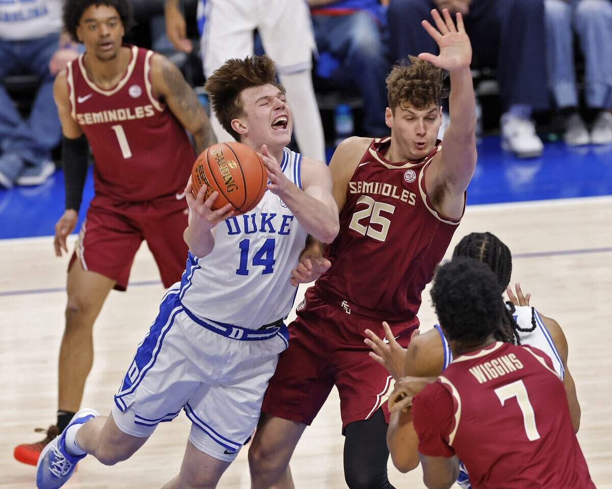 Duke’s Nikolas Khamenia drives against Florida State's Alex Steen (25) during the first half of the Blue Devils’ ACC Tournament quarterfinal game on Thursday, March 12, 2026, at the Spectrum Center in Charlotte, N.C.