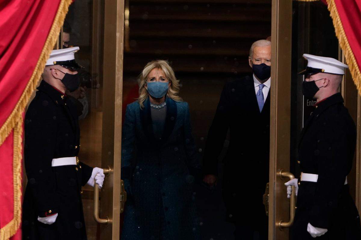 President-elect Joe Biden and his wife Jill, walk out for the 59th Presidential Inauguration at the U.S. Capitol in Washington, Wednesday, Jan. 20, 2021.(AP Photo/Patrick Semansky, Pool)